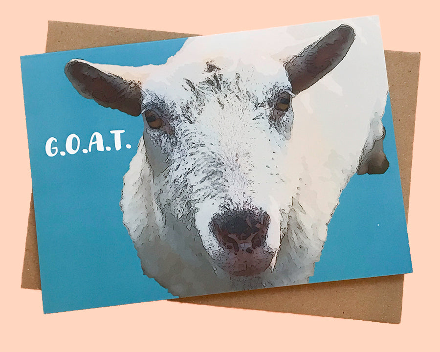 Greeting card of goat with G.O.A.T. text on turquoise background. From The Flower Moon Fox